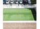 Aerial view of bocce ball courts with seating and shade umbrellas, offering a fun outdoor activity at 2297 Lark E Cir # E, Palm Harbor, FL 34684
