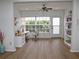 Bright home office with a large window, desk, and built-in shelving for storage at 2297 Lark E Cir # E, Palm Harbor, FL 34684