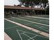 Well-maintained shuffleboard courts with covered seating areas for a relaxing and social recreation experience at 2297 Lark E Cir # E, Palm Harbor, FL 34684