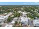 Aerial view of a quaint town featuring a mix of residential and commercial buildings nestled among lush green trees at 280 Dr Ml King Jr N St, Safety Harbor, FL 34695