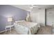 Comfortable bedroom with a white iron bed frame, dresser, and closet at 280 Dr Ml King Jr N St, Safety Harbor, FL 34695