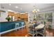 Stylish dining area with hardwood floors, modern lighting, and a view into the kitchen at 280 Dr Ml King Jr N St, Safety Harbor, FL 34695
