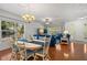 Open-concept dining room with hardwood floors, ample natural light, and views of the living area at 280 Dr Ml King Jr N St, Safety Harbor, FL 34695