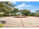 Picturesque water fountain nestled in a serene park setting, surrounded by lush trees, benches, and a spacious paved area at 280 Dr Ml King Jr N St, Safety Harbor, FL 34695