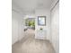 Hallway with multiple closets leading into a bedroom, filled with natural light at 280 Dr Ml King Jr N St, Safety Harbor, FL 34695