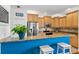 Modern kitchen with stainless steel appliances, granite countertops, and a breakfast bar at 280 Dr Ml King Jr N St, Safety Harbor, FL 34695