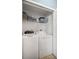 Laundry room with white washer and dryer and storage shelves at 280 Dr Ml King Jr N St, Safety Harbor, FL 34695