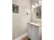 Powder room with a vanity, framed print, and decorative light fixture at 280 Dr Ml King Jr N St, Safety Harbor, FL 34695