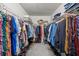Spacious walk-in closet with shelving and hanging racks for organization at 280 Dr Ml King Jr N St, Safety Harbor, FL 34695