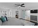Spacious bedroom with ceiling fan, work area, walk-in closet and a bathroom at 2912 W Winthrop Rd, Tampa, FL 33611