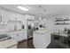 Bright kitchen with stainless steel appliances, granite countertops and backsplash, and an island at 2912 W Winthrop Rd, Tampa, FL 33611
