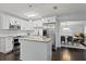 Bright kitchen with stainless steel appliances, granite countertops and backsplash, and an island at 2912 W Winthrop Rd, Tampa, FL 33611