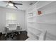 An office area features a built-in bookshelf and a comfortable chair at 2912 W Winthrop Rd, Tampa, FL 33611