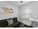 A functional office space including a futon and a modern desk setup at 2912 W Winthrop Rd, Tampa, FL 33611