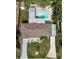Aerial view of a house with a swimming pool, patio, and well-maintained landscaping at 2915 67Th Way N, St Petersburg, FL 33710
