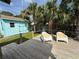 Private backyard retreat with a shed, comfortable seating, and lush landscaping at 2915 67Th Way N, St Petersburg, FL 33710