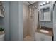 Stylish bathroom with granite vanity top, tiled shower, and modern fixtures, providing a comfortable and functional space at 2915 67Th Way N, St Petersburg, FL 33710