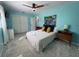 Spacious bedroom with blue walls, plush carpet, and a well-lit atmosphere, perfect for relaxation at 2915 67Th Way N, St Petersburg, FL 33710