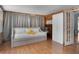 Cozy bedroom features wood-paneled wall with a trundle daybed and a closet with glass doors at 2915 67Th Way N, St Petersburg, FL 33710