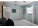 Cozy bedroom with light blue walls, a closet with sliding doors, and bright natural light at 2915 67Th Way N, St Petersburg, FL 33710