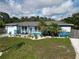 Charming home with colorful exterior, featuring well-manicured lawn and inviting front porch at 2915 67Th Way N, St Petersburg, FL 33710