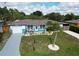 Charming single-story home with a well-manicured lawn, landscaped front yard, and a driveway at 2915 67Th Way N, St Petersburg, FL 33710