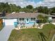 Charming one-story home with a well-manicured lawn, lush landscaping, and freshly painted exterior at 2915 67Th Way N, St Petersburg, FL 33710