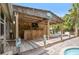 An outdoor bar features a wood deck, bar seating, and a TV entertainment area at 2915 67Th Way N, St Petersburg, FL 33710