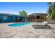 Beautiful pool area with a spacious patio, a built-in bar, and comfortable lounge chairs, perfect for entertaining at 2915 67Th Way N, St Petersburg, FL 33710