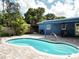 Private backyard pool with lush tropical landscaping, patio, and bar at 2915 67Th Way N, St Petersburg, FL 33710
