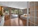 Inviting sunroom with wood-paneled walls, sliding glass doors, and a cozy daybed, perfect for relaxation at 2915 67Th Way N, St Petersburg, FL 33710