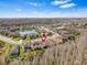 The aerial view displays a beautiful community surrounded by lakes and natural wooded areas, providing a peaceful setting at 31046 Lindentree Dr, Wesley Chapel, FL 33543