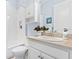 Charming bathroom featuring a shower-tub combo, white vanity, neutral countertop and decorative accents at 31046 Lindentree Dr, Wesley Chapel, FL 33543