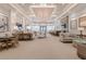 Expansive clubhouse with stylish furniture, a fireplace, and a bar area at 31046 Lindentree Dr, Wesley Chapel, FL 33543