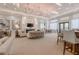 Elegant clubhouse featuring a fireplace, stylish seating, and chandeliers at 31046 Lindentree Dr, Wesley Chapel, FL 33543