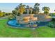 The community's welcoming fountain features a stone waterfall with 'The Ridge' signage surrounded by beautiful landscaping at 31046 Lindentree Dr, Wesley Chapel, FL 33543