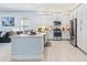 Modern kitchen featuring stainless steel appliances, white cabinetry, and light countertops at 31046 Lindentree Dr, Wesley Chapel, FL 33543