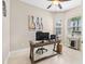 Functional home office featuring a desk, computer setup, and natural light for productivity at 31046 Lindentree Dr, Wesley Chapel, FL 33543