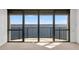 Bright room with large windows leading to a balcony, offering stunning views of the sparkling waters at 3301 Bayshore Blvd # 2007B, Tampa, FL 33629