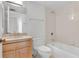 Bathroom featuring wood vanity, matching toilet and tub with shower at 3301 Bayshore Blvd # 2007B, Tampa, FL 33629