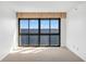 Bright bedroom featuring a wall of windows offering serene water views at 3301 Bayshore Blvd # 2007B, Tampa, FL 33629