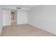 Minimalist bedroom with neutral carpet and a view into the adjacent bathroom at 3301 Bayshore Blvd # 2007B, Tampa, FL 33629