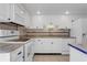 Traditional kitchen with white cabinets, tile backsplash, and granite countertops at 3301 Bayshore Blvd # 2007B, Tampa, FL 33629