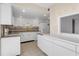 Bright kitchen with white cabinets, granite countertops, and modern appliances at 3301 Bayshore Blvd # 2007B, Tampa, FL 33629