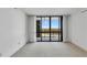 Living room featuring carpet, floor to ceiling windows and balcony access at 3301 Bayshore Blvd # 2007B, Tampa, FL 33629
