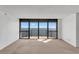Bright living room featuring a wall of windows providing panoramic water views and natural light at 3301 Bayshore Blvd # 2007B, Tampa, FL 33629