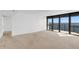 Open living space with large sliding doors to the balcony, offering stunning water views and ample natural light at 3301 Bayshore Blvd # 2007B, Tampa, FL 33629