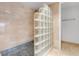 Contemporary shower featuring glass block accent wall and tiled bench seat at 3301 Bayshore Blvd # 2007B, Tampa, FL 33629