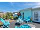 Inviting patio with light blue furniture, perfect for outdoor relaxation and entertaining at 3307 Maitland Dr, Holiday, FL 34691