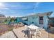 Backyard view features a patio for outdoor relaxation and vibrant landscaping around the home at 3307 Maitland Dr, Holiday, FL 34691
